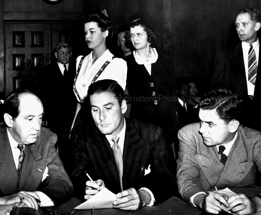 Errol Flynn 1943 2 With Attorney Jerry Geisler (on left) in Los Angeles Courtroom explaining his aquaintance of the two teen-age girls accusing him of rape. WM.jpg